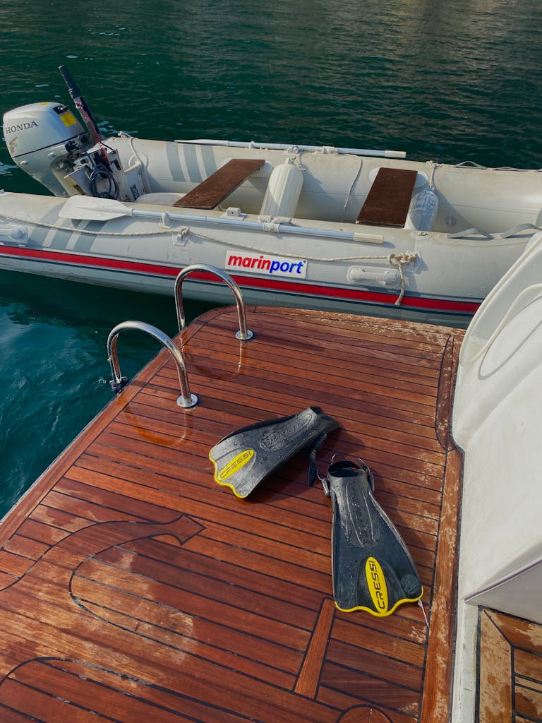 Inflatable motorboat docked at a pier in Burgazadası, Istanbul, perfect for summer adventures.